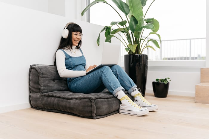 Appmatics tester on a seat cushion with headset