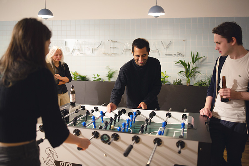 Employees playing kicker